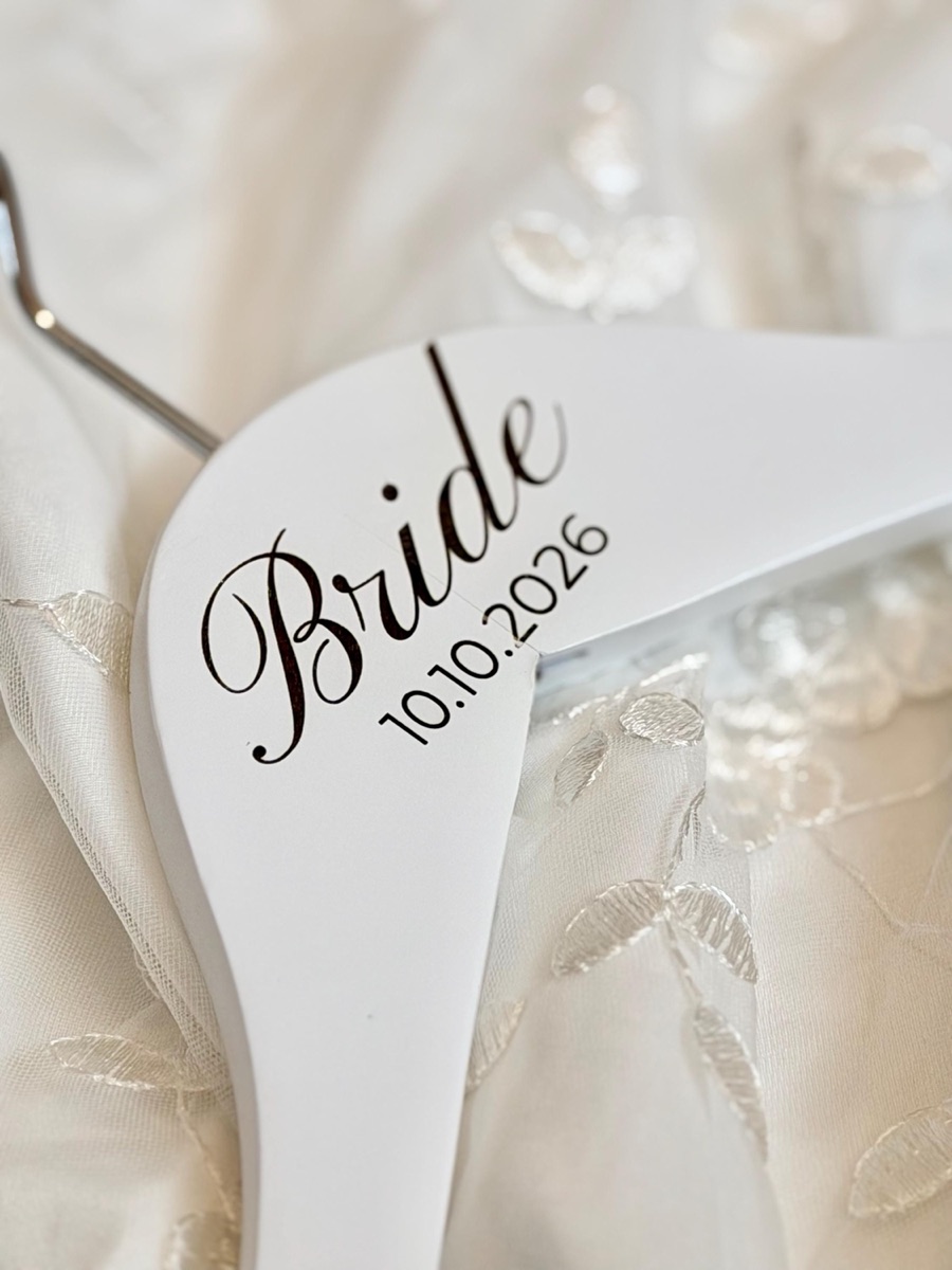 White hanger engraved Bride 10.10.2026, layout C, on embroidered lace