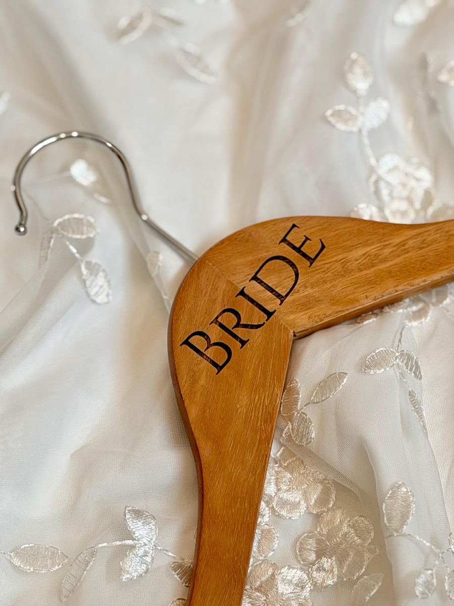 Eucalyptus hanger engraved BRIDE in a serif capital font